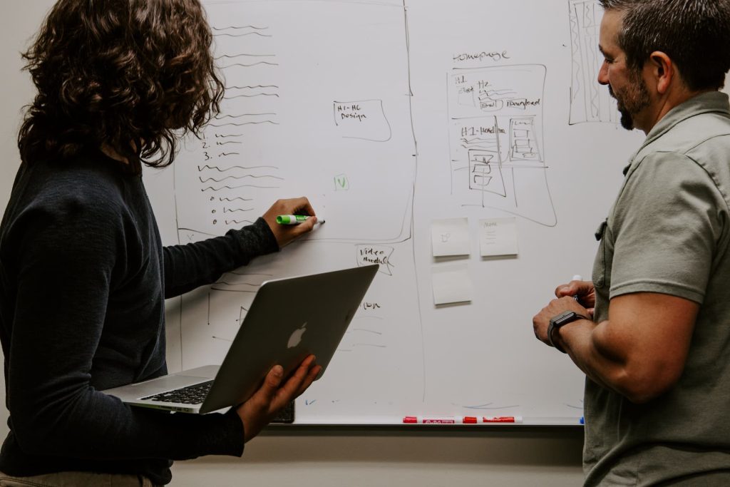 QBCC accountant writing on a white board