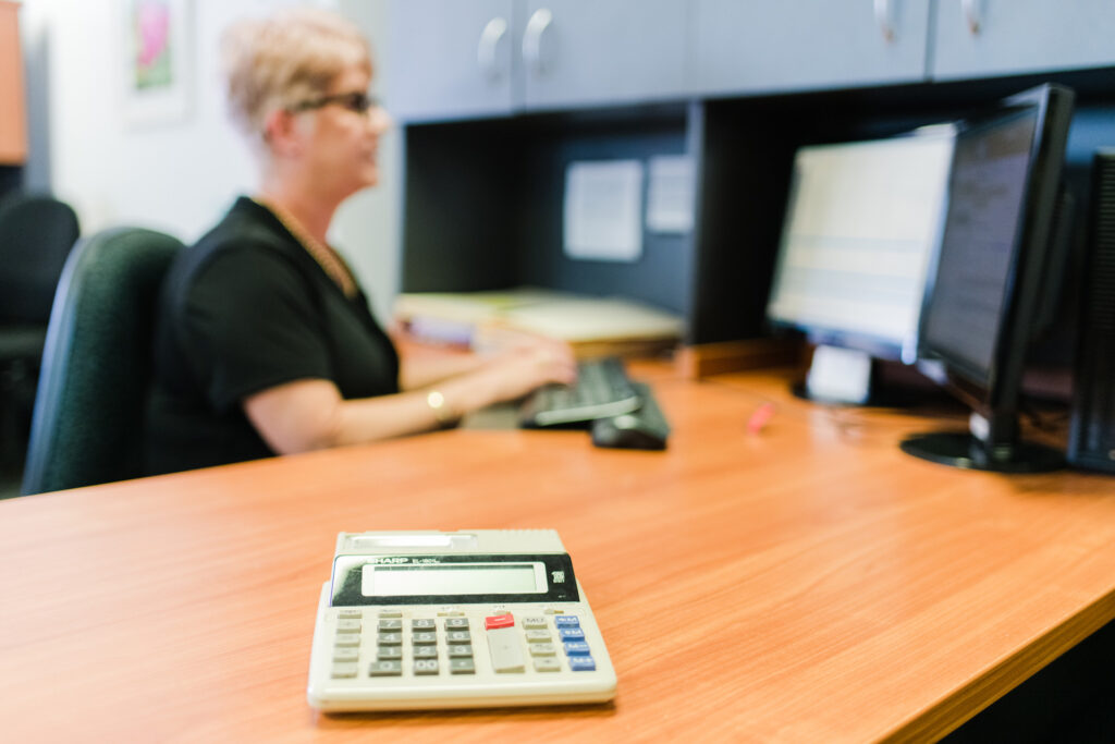 A accountant in Brisbane working on a computer