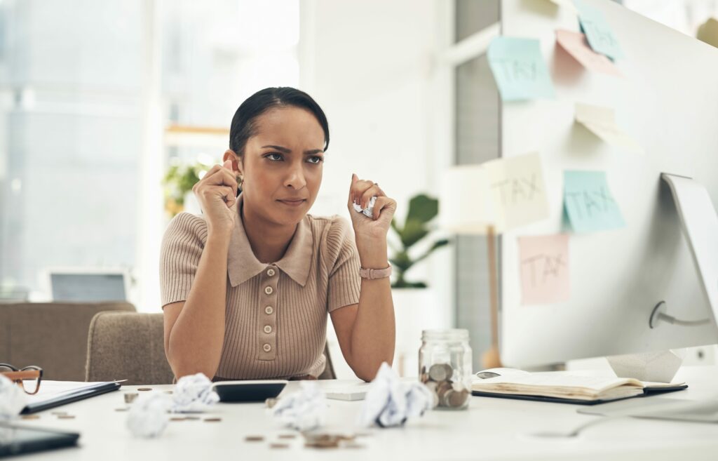 young woman frustrated with their small business accounting without the use of Xero for their small business