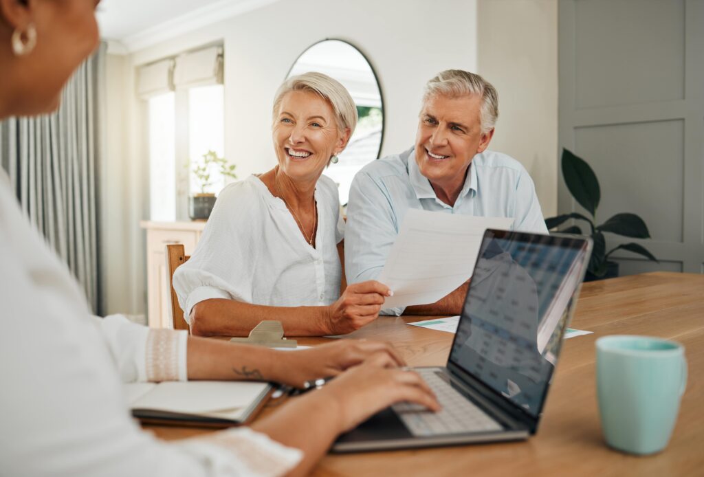 Elderly couple discussing their Self-Managed Super Fund with Agilis CA to better understand tax in retirement