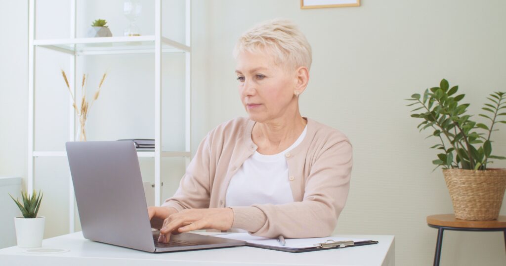 Elder woman planning her SMSF investments to maximise tax during retirement