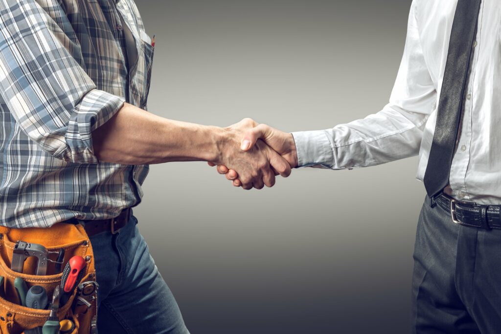 A Contractor And An Employer Shake Hands